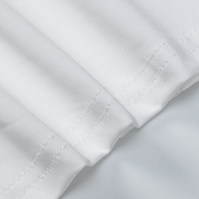 White long-sleeve cuff and seam finish close-up on maxi dress fabric