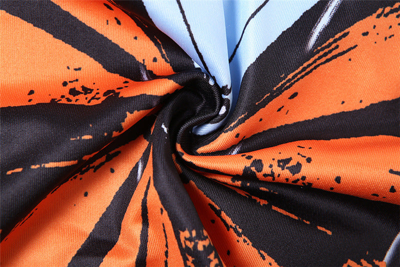 Close-up of multicolor butterfly-print fabric with front knot detail