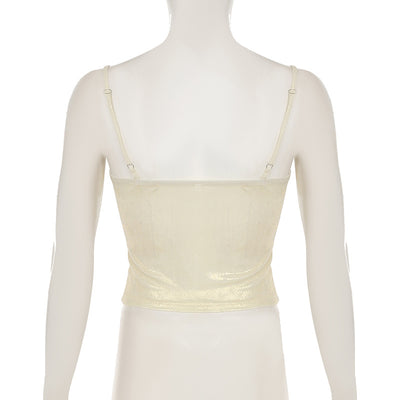 Beige twist-front cami top with slim spaghetti straps and shaped bust seams