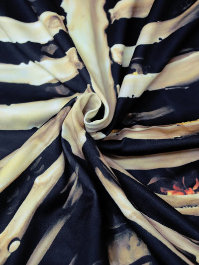 Black midi dress with beige skeleton print