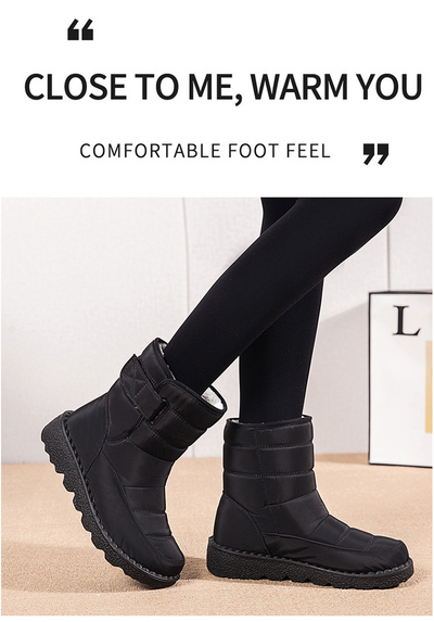 Black winter ankle boots with side buckle and plush lining, angled front view.