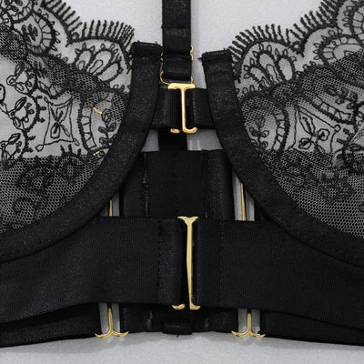 Black lace garter set with cross straps and gold-tone center hardware