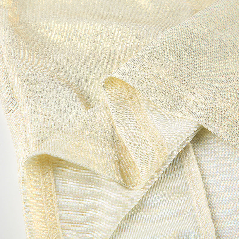 Beige cami top close-up: ruched twist-front seam and strap loop detail