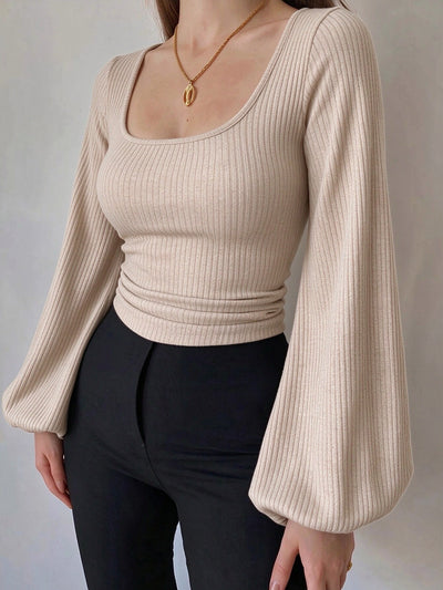 Beige ribbed knit square-neck long-sleeve top with lantern sleeves and fitted waist