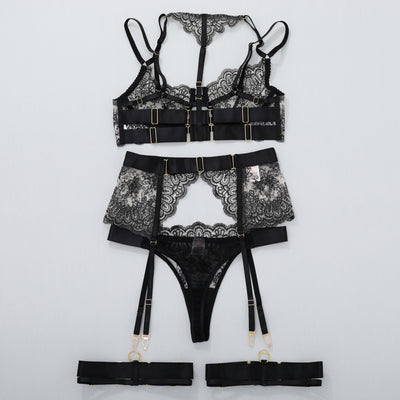 Black lace lingerie set with garter belt and thigh straps, matching thong