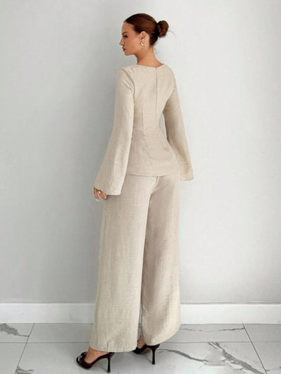 Beige wide-leg pants set with shaped top and flared sleeves, full-length wide pants