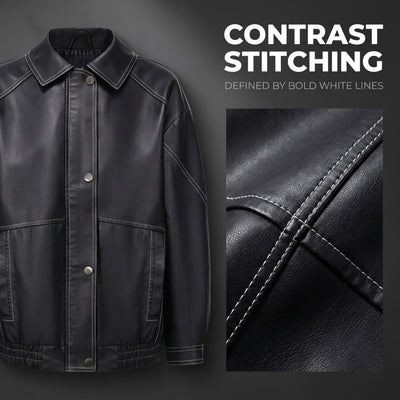 Black faux leather jacket with bold contrast stitching and snap-button front, textured finish