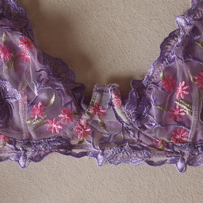 Lilac lingerie bottom with floral embroidery, lace trim, and scalloped elastic edges