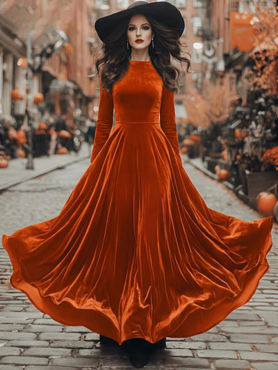 Orange velvet maxi dress with long sleeves and flared skirt