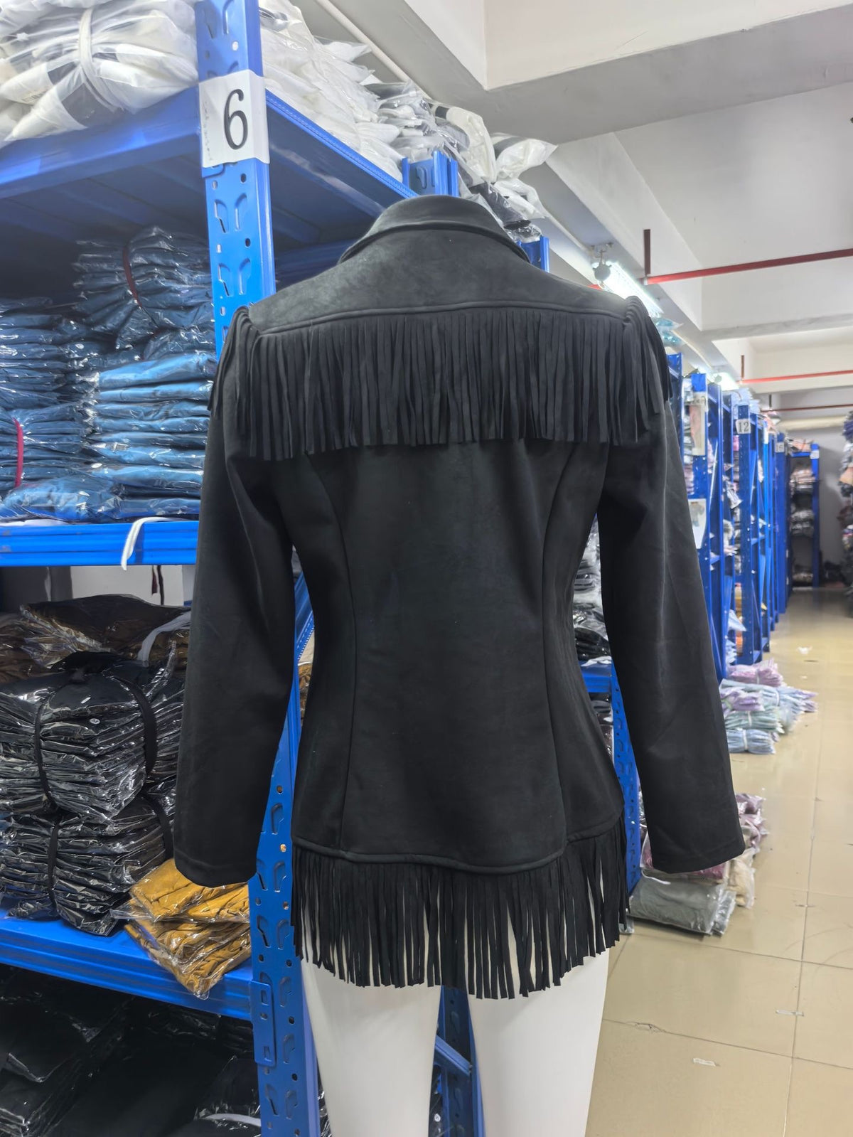 Black fringe jacket back with shaped seams, fringe yoke and bottom fringe