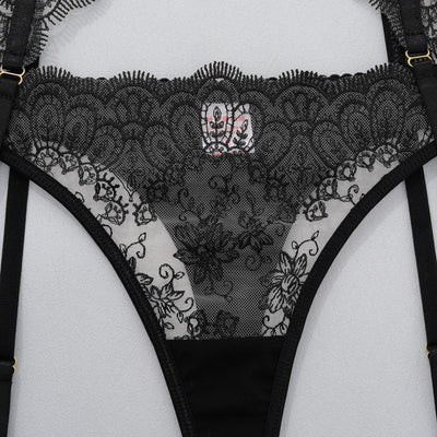 Black lace thong underwear with decorative mesh panel and garter belt straps