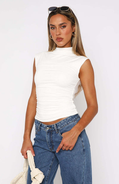 Ruched mock neck sleeveless tank top, white fitted design, front 3/4 view