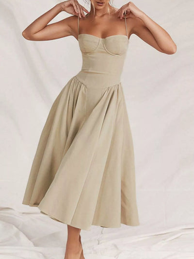 Beige dress worn by a model on a plain background