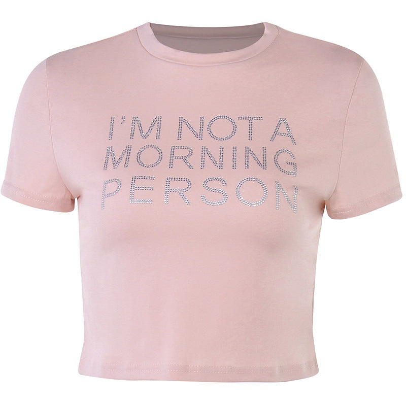 Trendsi light pink Crop T-Shirt short sleeve cropped tee with rhinestone slogan reading IM NOT A MORNING PERSON