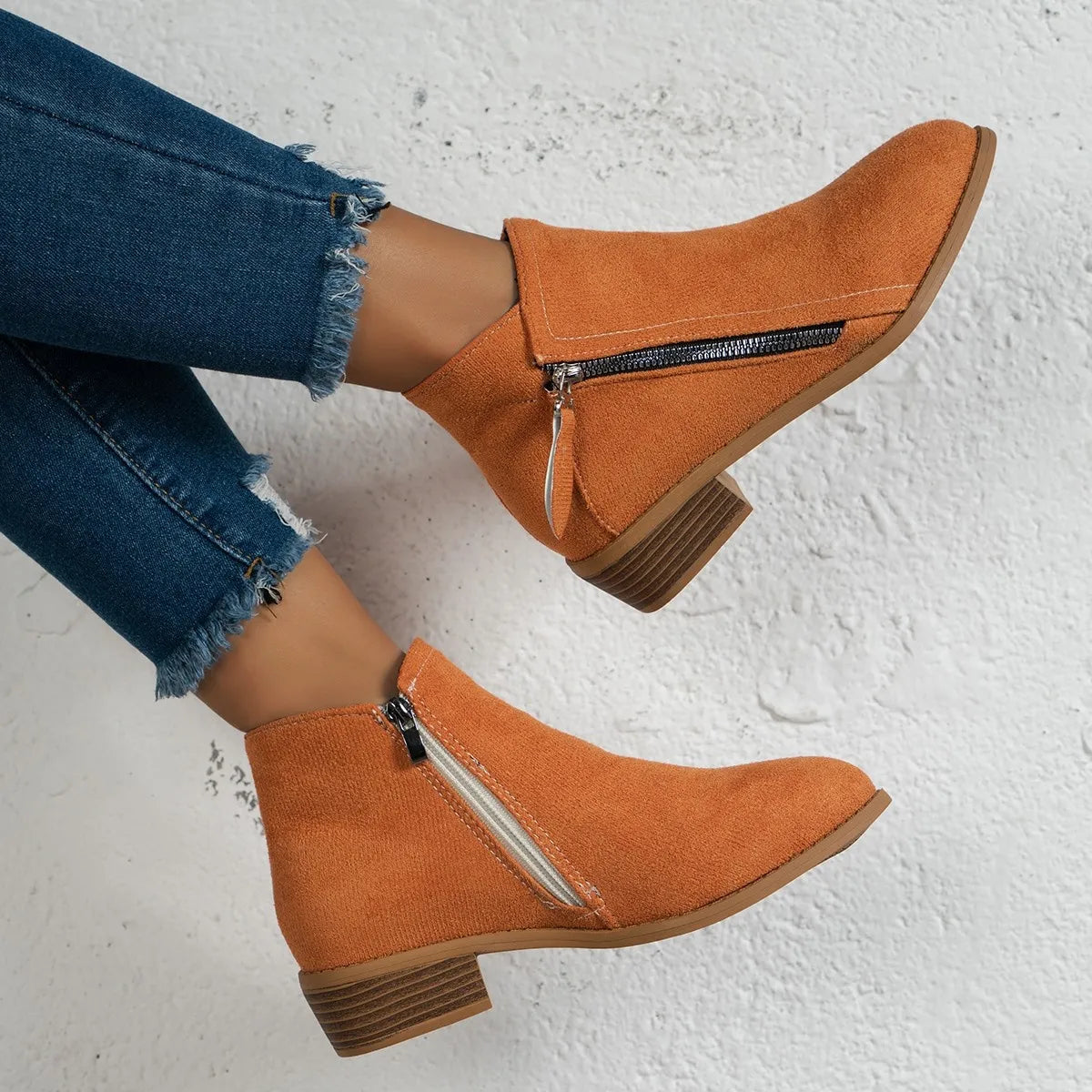 Trendsi women's side zip ankle boots in cognac suede with low stacked heel worn with frayed hem jeans