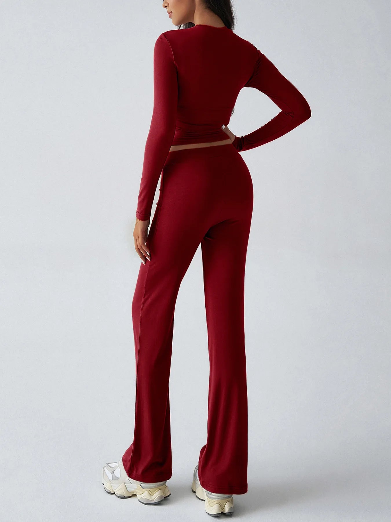 Trendsi Burgundy Top and Pant Set featuring a fitted long-sleeve top and flared pants for a stylish look